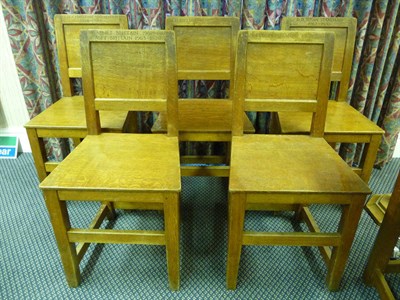 Lot 1839 - Five Robert "Mouseman" Thompson Oak Panel Back and Seat Chairs, on square section legs, joined by a