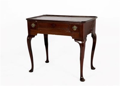 Lot 391 - A George II Walnut Dressing Table, mid 18th century, the moulded top with re-entrant corners...