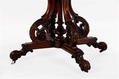 Lot 411 - A Victorian Burr Walnut and Carved Centre Table, circa 1870, of rounded rectangular form with...