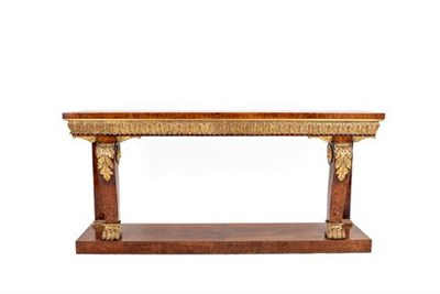 Lot 418 - A Victorian Brown Oak and Parcel Gilt Console Table, in the manner of William Kent, mid 19th...