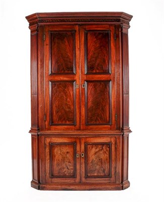 Lot 428 - A George III Mahogany Free-Standing Corner Cabinet, Early 19th Century, the moulded cornice above a