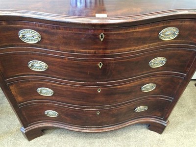 Lot 434 - A George III Mahogany Serpentine Shaped Chest, late 18th century, the moulded top above four...