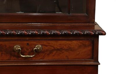 Lot 438 - A Late George III Mahogany Bookcase, early 19th century, the dentil and blind fret carved...