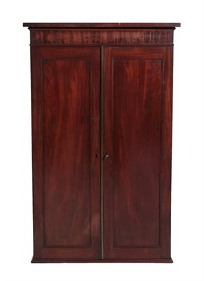 Lot 441 - A Mahogany Wall Cabinet, 2nd quarter 19th century, with two panel doors enclosing an arrangement of