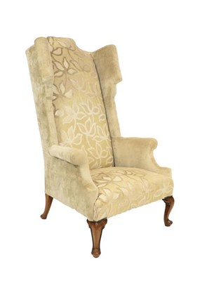 Lot 449 - An Oversized Queen Anne Style Armchair, late 19th/early 20th century, recovered in cream cut...