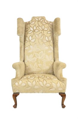 Lot 449 - An Oversized Queen Anne Style Armchair, late 19th/early 20th century, recovered in cream cut...
