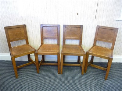 Lot 1846 - A Set of Four Martin "Lizardman" Dutton Oak Panel Back Chairs, each with carved lizard...