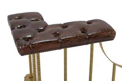 Lot 468 - A 20th Century Brass Club Fender, covered in close-nailed buttoned brown leather, the corner...
