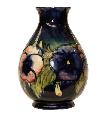 Lot 47 - A Moorcroft Pansies pattern vase, blue ground, painted and impressed marks, 25cm