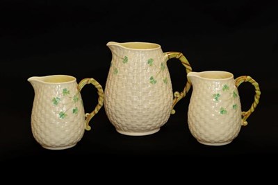Lot 50 - A Belleek basket moulded jug, together with a pair of smaller examples, and a group of cut...