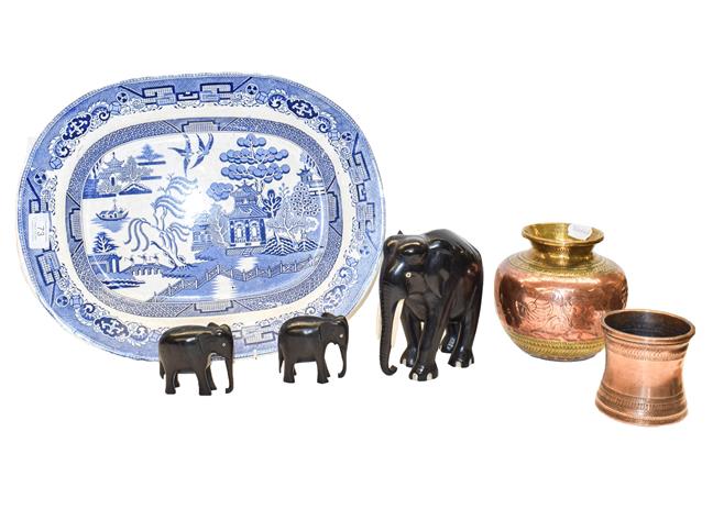 Lot 73 - An Indian copper and brass vase, a copper vase, three ebony and bone elephants, and three blue...