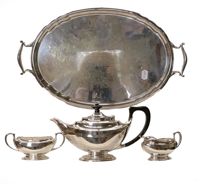 Lot 87 - A silver three-piece tea service marked for London and bearing a monogram, gross weight 999...