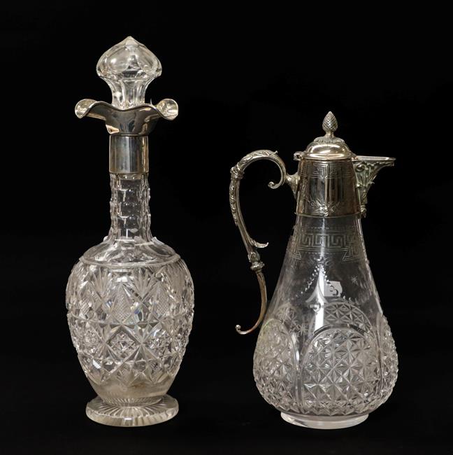 Lot 88 - A George V silver mounted cut glass decanter with three pouring spouts by Goldsmiths and...