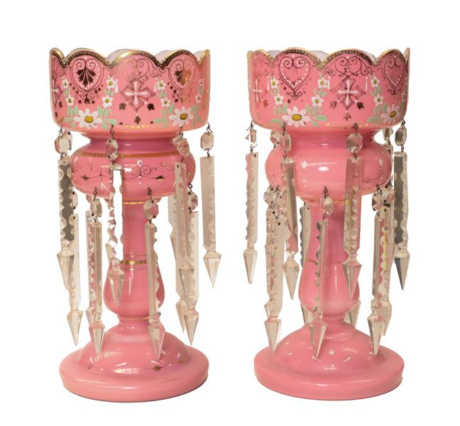 Lot 89 - A pair of early 20th century opaque pink glass table lustres with two rows of drops, 36cm
