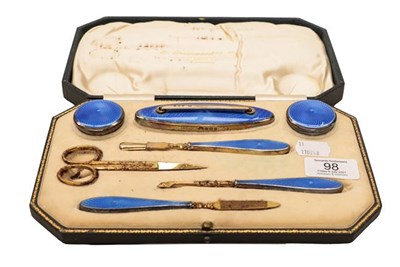 Lot 98 - A George V cased silver gilt enamelled manicure set by Adie Brothers, Birmingham, 1926, retailed by