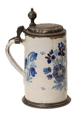 Lot 102 - An 18th century German faience stein, floral decoration (a.f.)
