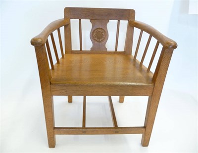 Lot 1856 - A Yorkshire School Oak Child's Arm Chair, the curved arms above three spindles, the back splat...