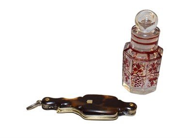 Lot 117 - A ruby and clear glass scent bottle, and a tortoiseshell lorgnette