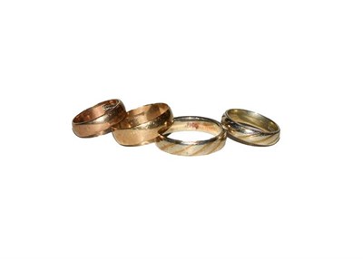 Lot 132 - Four 9 carat gold band rings, of varying designs and sizes