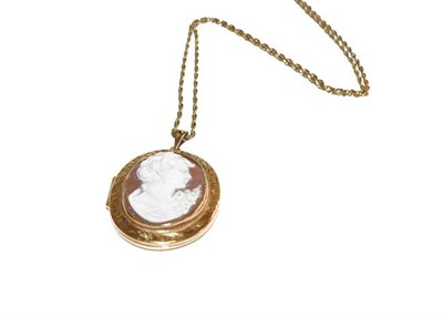 Lot 136 - A 9 carat gold locket cameo pendant on chain, pendant measures 6.3cm by 4.1cm, chain length 61.5cm