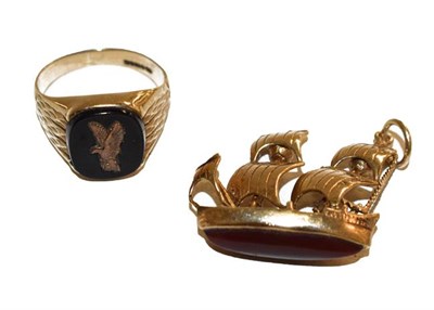 Lot 144 - A 9 carat gold signet ring, finger size N; and a 9 carat gold galleon pendant/charm