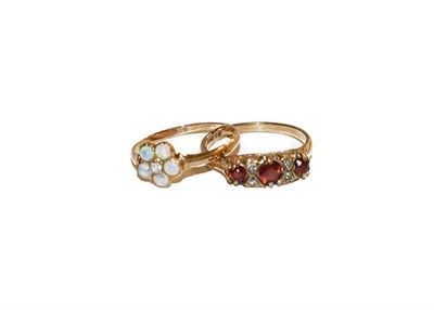 Lot 154 - A Tudor lady's wristwatch on a 9 carat gold bracelet, a 9 carat gold garnet and diamond ring,...