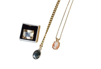 Lot 159 - A smoky quartz ring, stamped '9CT', finger size L, a moss agate pendant on a fancy link chain,...