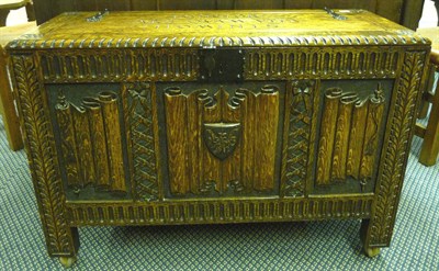 Lot 1862 - A 1930's Arts & Crafts Carved Oak Blanket Box, the hinged lid inscribed LONGIOR ARS QVAM VITA...