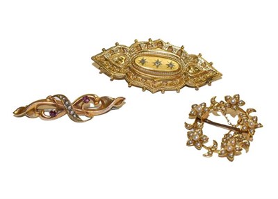 Lot 176 - Three Edwardian/Victorian brooches, of varying designs and sizes