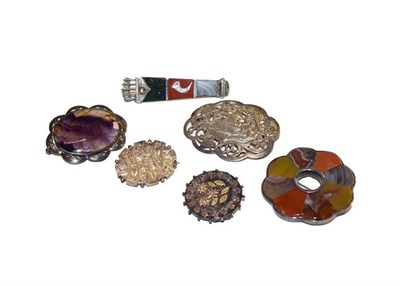 Lot 181 - Six brooches comprising of two agate brooches, three white metal brooches, and a blue john brooch