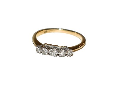 Lot 182 - A diamond five stone ring, the graduated old cut diamonds in white claw settings, to a yellow...