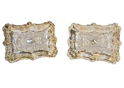 Lot 207 - A pair of Victorian silver shaped rectangular dishes with repousse scrolls and trellis panels,...
