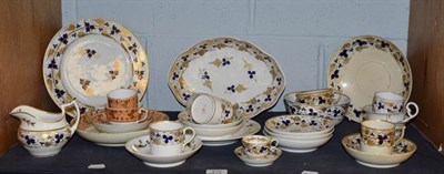 Lot 210 - A 19th century Derby part tea service decorated in blue and gilt, including a miniature cup and...