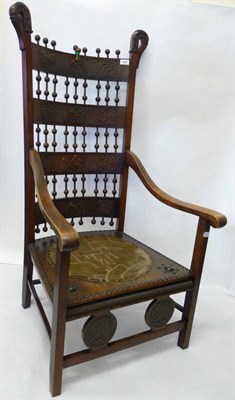 Lot 1866 - An Arts and Crafts Mahogany, Leather and Vellum Armchair, circa 1900, carved finals, the back...