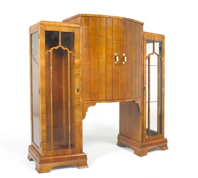 Lot 1868 - An Art Deco Walnut Cocktail/Display Cabinet, the central fitted section with hinged lift-up top and