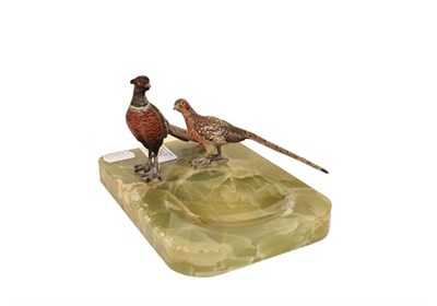 Lot 260 - Two Austrian cold painted bronze models of a cock and hen pheasant, mounted on a onyx dish