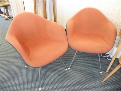 Lot 1874 - A Pair of Herman Miller Fibreglass Armchairs, upholstered in rust velour, on four chrome legs,...