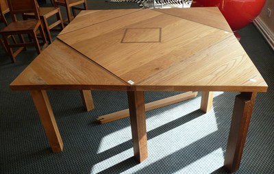 Lot 1881 - A Modern Bespoke Oak Table, inlaid square top with triangular leaf extensions and pullout supports