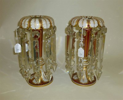 Lot 2 - A Pair of Bohemian White Overlay Red Glass Table Lustres, circa 1860, the everted rims cut and gilt