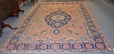 Lot 1003 - Tabriz carpet, the soft terracotta field of vines around an indigo medallion, framed by angular...