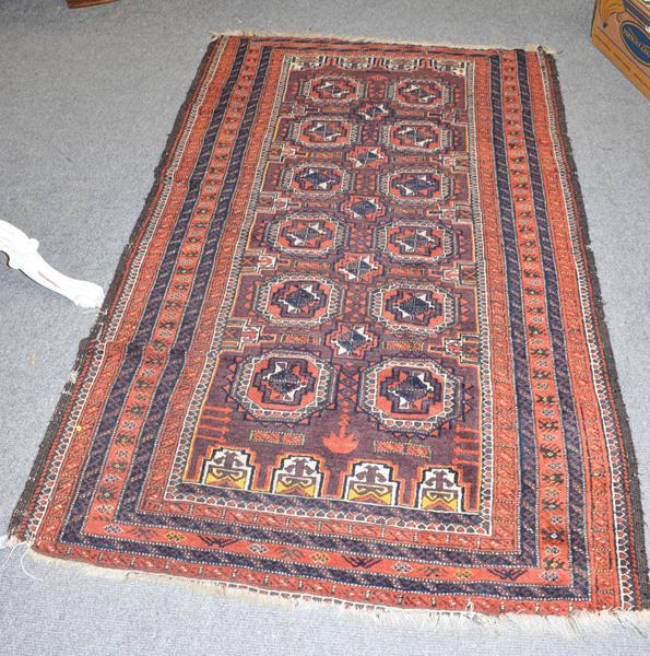 Lot 1005 - Baluch rug, the pale aubergine field of salor guls enclosed by multiple borders 183cm by 112cm
