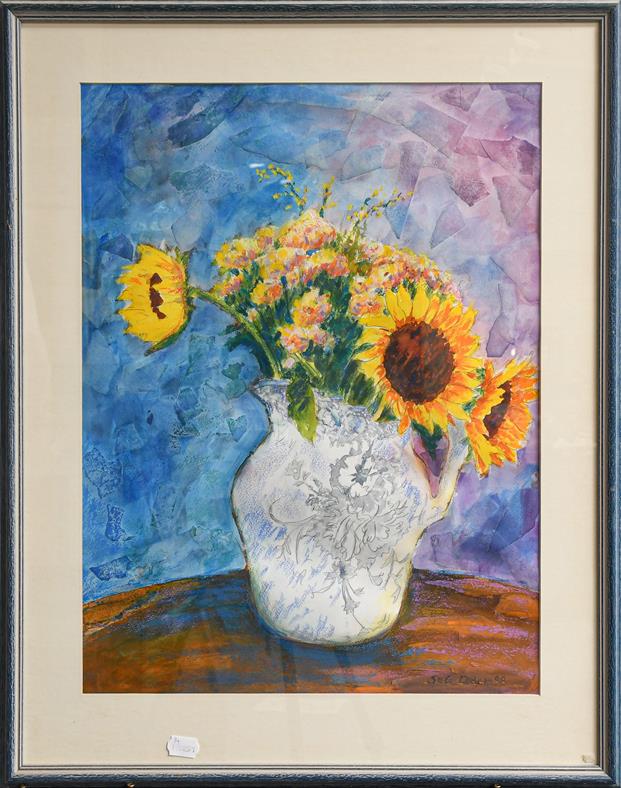 Lot 1015 - Sue Loder (contemporary) study of sunflowers in a white jug, mixed media, signed and dated...