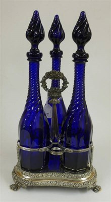 Lot 9 - A Set of Three  "Bristol " Blue Decanters and Stoppers, with wrythen knops and necks on...