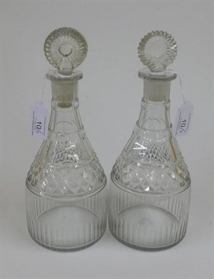Lot 10 - A Pair of Cut Glass Spirit Decanters and Two Stoppers, circa 1800, with disc knops, panelled...