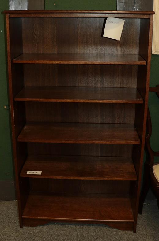 Lot 1091 - An oak open bookcase, 77cm by 30cm by 137cm, a G Plan style nest of three tables and a mid 20th...