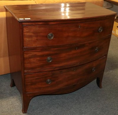 Lot 1105 - A George III mahogany three height bow front chest of drawers, 94cm by 54cm by 89cm