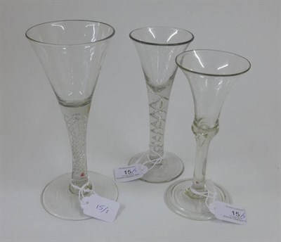 Lot 15 - A Wine Glass, circa 1760, the drawn trumpet bowl on a two-ply mercury air twist stem and...
