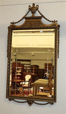 Lot 1116 - A 20th century Neo-Classical style hall mirror adorned with an urn shaped pediment, 56.5cm by...