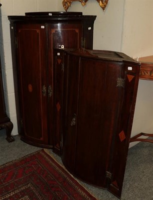 Lot 1117 - A George III mahogany bow-front wall hanging corner cupboard, with another (2)