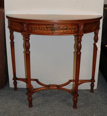 Lot 1118 - A reproduction satinwood and polychrome decorated demi lune side table, 94cm by 39cm by 83cm
